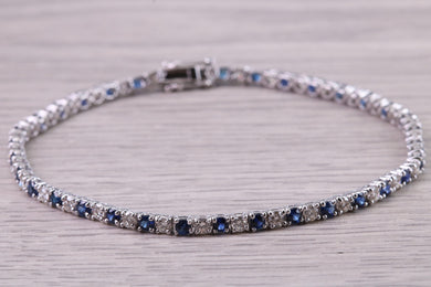 Five carats Natural Blue Sapphire and Diamonds set White Gold Tennis Bracelet, British Hallmarked