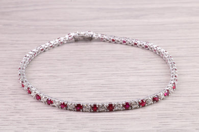 Four carats Natural Rubies and Diamonds set Solid White Gold Tennis Bracelet, British Hallmarked