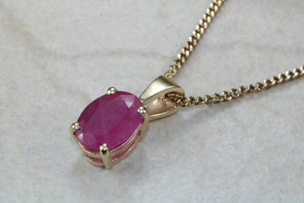 Two carat Oval cut Ruby set Yellow Gold Solitaire Necklace