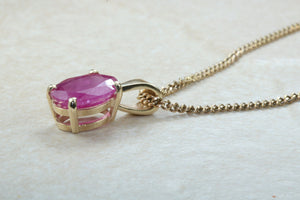 Two carat Oval cut Ruby set Yellow Gold Solitaire Necklace