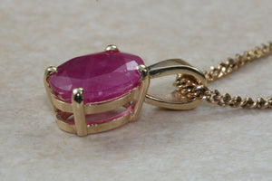 Two carat Oval cut Ruby set Yellow Gold Solitaire Necklace