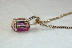 Two carat Oval cut Ruby set Yellow Gold Solitaire Necklace