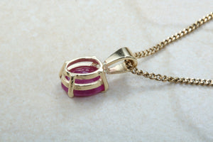 Two carat Oval cut Ruby set Yellow Gold Solitaire Necklace