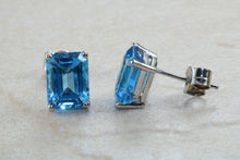 Load image into Gallery viewer, Natural Emerald cut blue Topaz stud earrings set in solid 9ct white gold