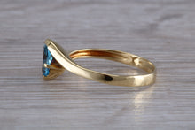 Load image into Gallery viewer, One carat Oval cut Blue Topaz set 18ct Yellow Gold Ring