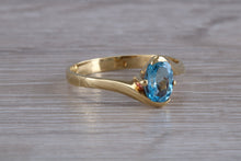 Load image into Gallery viewer, One carat Oval cut Blue Topaz set 18ct Yellow Gold Ring