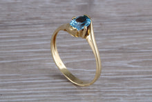 Load image into Gallery viewer, One carat Oval cut Blue Topaz set 18ct Yellow Gold Ring