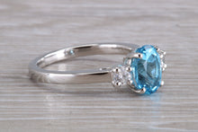 Load image into Gallery viewer, Blue Topaz and Diamond set Platinum Trilogy Ring