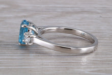 Load image into Gallery viewer, Blue Topaz and Diamond set Platinum Trilogy Ring