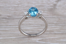Load image into Gallery viewer, Blue Topaz and Diamond set Platinum Trilogy Ring