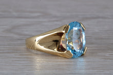 Load image into Gallery viewer, Large 9 carat Oval cut Blue Topaz set 18ct Yellow Gold Ring