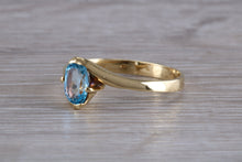 Load image into Gallery viewer, One carat Oval cut Blue Topaz set 18ct Yellow Gold Ring