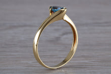 Load image into Gallery viewer, One carat Oval cut Blue Topaz set 18ct Yellow Gold Ring
