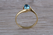 Load image into Gallery viewer, One carat Oval cut Blue Topaz set 18ct Yellow Gold Ring
