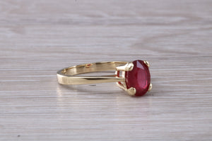 Two carat Oval cut Ruby set Yellow Gold Solitaire