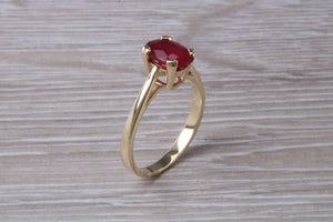 Two carat Oval cut Ruby set Yellow Gold Solitaire