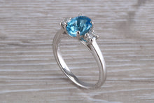 Load image into Gallery viewer, Blue Topaz and Diamond set Platinum Trilogy Ring