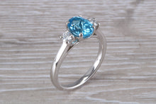 Load image into Gallery viewer, Blue Topaz and Diamond set Platinum Trilogy Ring