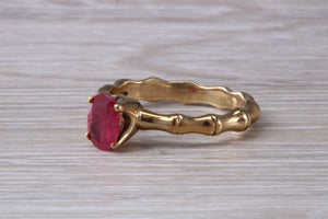 One carat Oval cut Ruby set Tree Branch Solitaire