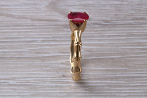One carat Oval cut Ruby set Tree Branch Solitaire