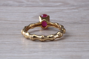 One carat Oval cut Ruby set Tree Branch Solitaire