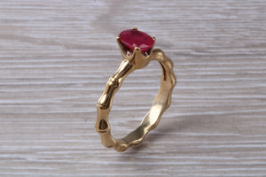 One carat Oval cut Ruby set Tree Branch Solitaire