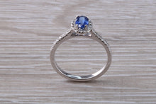 Load image into Gallery viewer, Absolutely Beautiful Blue Sapphire and Halo set Diamond Ring