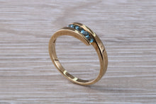 Load image into Gallery viewer, Sky Blue Topaz set Yellow Gold Twist Shank Ring