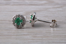 Load image into Gallery viewer, Emerald and Diamond Halo set 18ct White Gold Stud Earrings