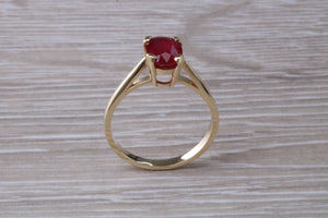 Two carat Oval cut Ruby set Yellow Gold Solitaire