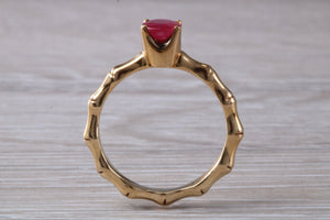 One carat Oval cut Ruby set Tree Branch Solitaire