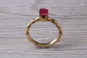 One carat Oval cut Ruby set Tree Branch Solitaire