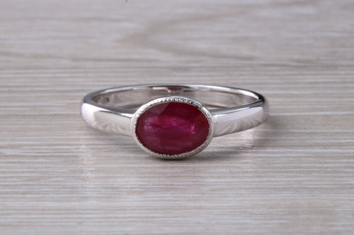 1.25 carat Oval cut Ruby set 18ct White Gold Solitaire
