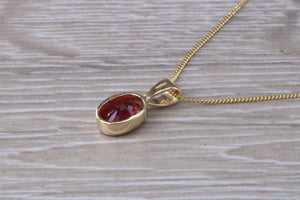 Oval cut Ruby set Yellow Gold Solitaire Necklace