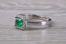 Load image into Gallery viewer, Emerald and Diamond Halo set Platinum Ring