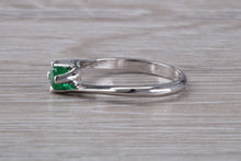 Load image into Gallery viewer, Half carat Round cut Emerald set Twist Solitaire