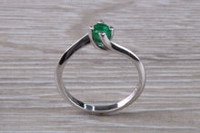 Load image into Gallery viewer, Half carat Round cut Emerald set Twist Solitaire