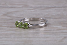 Load image into Gallery viewer, Round cut Peridot set 18ct White Gold Trilogy Ring
