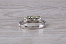 Load image into Gallery viewer, Round cut Peridot set 18ct White Gold Trilogy Ring