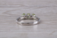 Load image into Gallery viewer, Round cut Peridot set 18ct White Gold Trilogy Ring