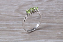 Load image into Gallery viewer, Round cut Peridot set 18ct White Gold Trilogy Ring