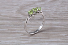 Load image into Gallery viewer, Round cut Peridot set 18ct White Gold Trilogy Ring
