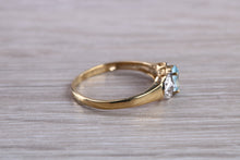 Load image into Gallery viewer, Blue Topaz and Diamond set Yellow Gold Ring