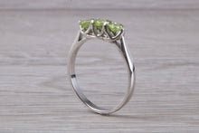 Load image into Gallery viewer, Round cut Peridot set 18ct White Gold Trilogy Ring