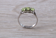 Load image into Gallery viewer, Round cut Peridot set 18ct White Gold Trilogy Ring