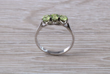 Load image into Gallery viewer, Round cut Peridot set 18ct White Gold Trilogy Ring