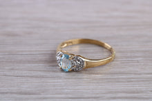Load image into Gallery viewer, Blue Topaz and Diamond set Yellow Gold Ring