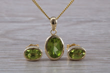 Load image into Gallery viewer, Oval cut Peridot Earrings and Matching Necklace set in Yellow Gold