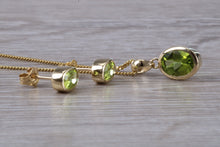 Load image into Gallery viewer, Oval cut Peridot Earrings and Matching Necklace set in Yellow Gold