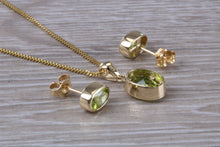 Load image into Gallery viewer, Oval cut Peridot Earrings and Matching Necklace set in Yellow Gold